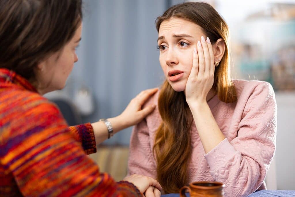 a person comforts their friend after learning ways to recognize fentanyl addiction