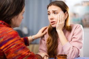 a person comforts their friend after learning ways to recognize fentanyl addiction