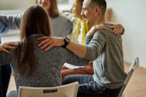 a group hugs after learning Where to get help for alcoholism