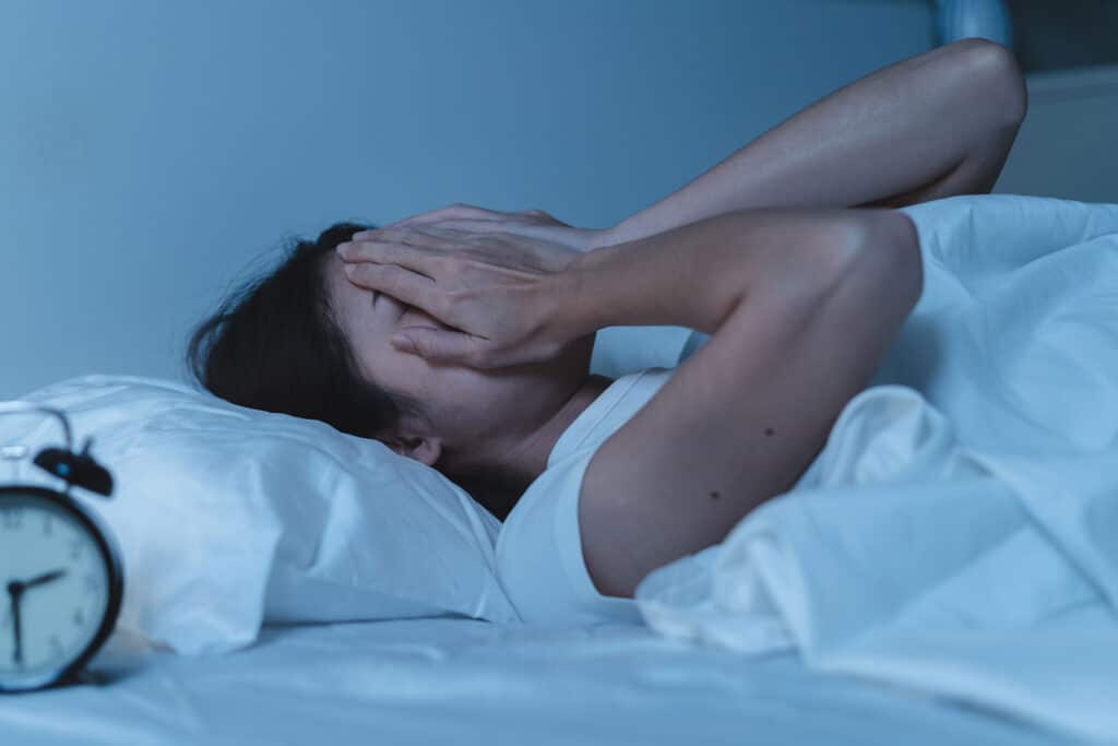 a person experiences alcohol withdrawals causing vivid dreams while laying in bed