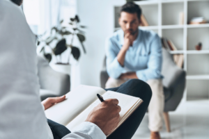 a patient talks to a therapist about how are co-occurring disorders treated