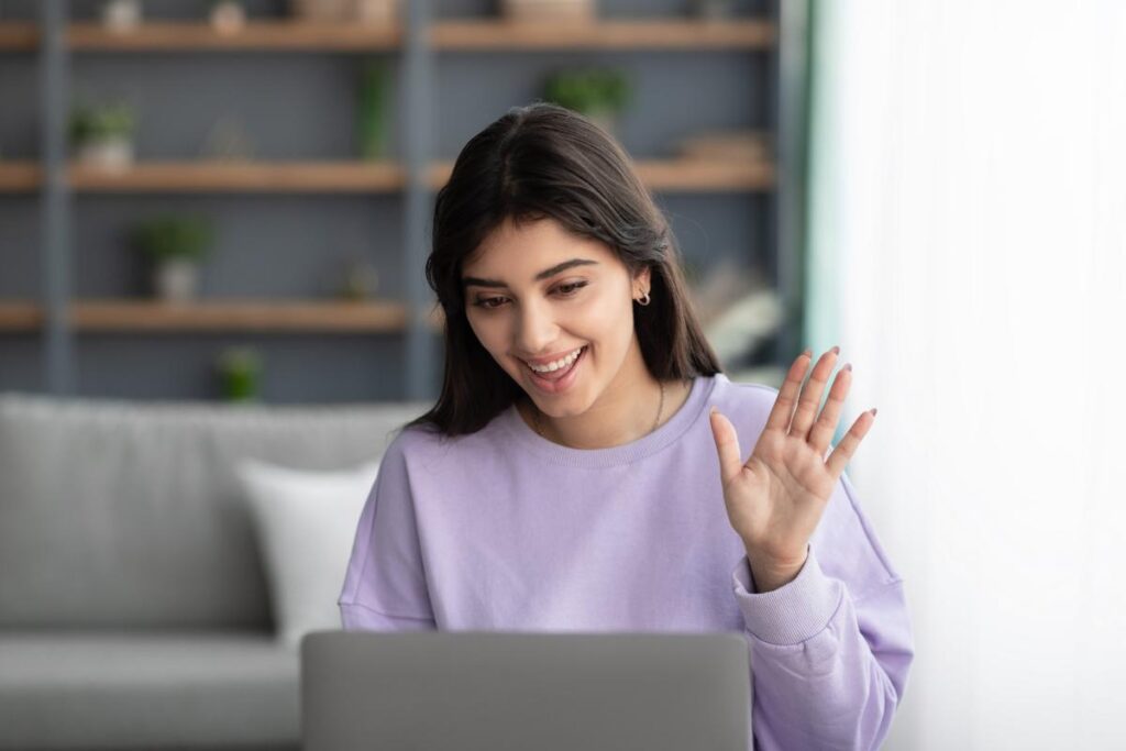 a person who has find a virtual intensive outpatient program in loveland co participates on a computer by waving at the screen