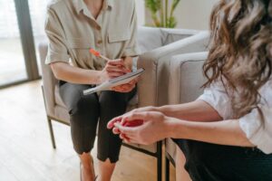 a patient and a therapist talk about an intensive outpatient program