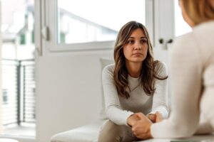 a person talks to a therapist during meth treatment